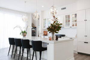 Modern kitchen in Hawthorn home with marble benchtops and soft wood accents designed by Erica Interiors