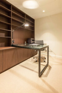 Neutral-toned home office with oak cabinetry and textured decor styled by Erica Interiors in Hawthorn
