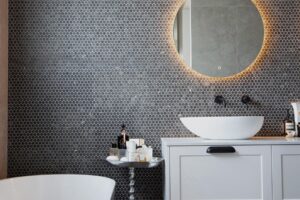 Bespoke bathroom design in Toorak with stone surfaces and minimalist detailing