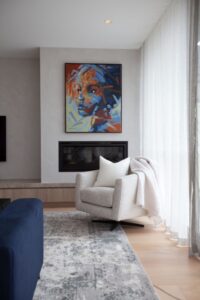 Contemporary living space with soft furnishings and custom joinery designed in Hawthorn